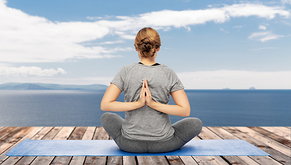 Image showing woman doing yoga over atlantic ocean