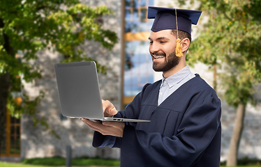 Image showing male graduate student or bachelor with laptop