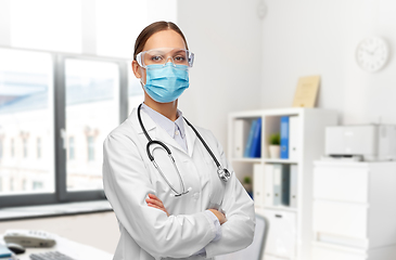 Image showing female doctor in goggles and medical mask