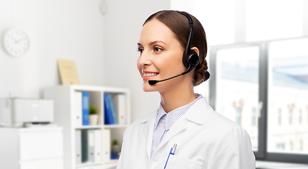 Image showing smiling female doctor with headset