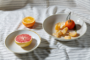 Image showing still life with mandarins and grapefruit on plate