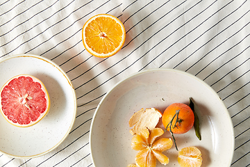 Image showing still life with mandarins and grapefruit on plate