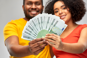 Image showing happy african american couple with euro money