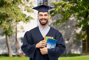 Image showing happy graduate student or bachelor with books