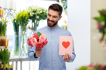 Image showing happy man with flowers and valentine's day card