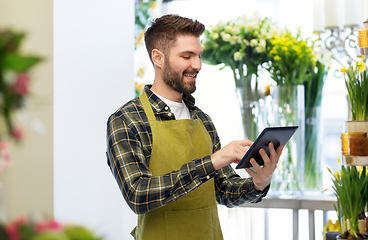 Image showing happy male gardener or farmer with tablet pc