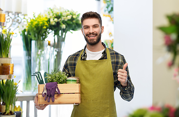 Image showing happy gardener or farmer with box of garden tools