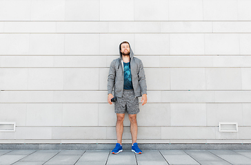 Image showing sportsman with bottle of water in city