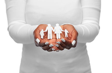 Image showing hands of african american woman with paper family