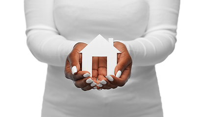 Image showing hands of african american woman holding house