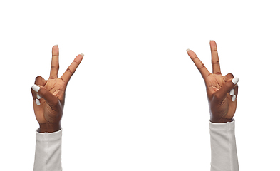 Image showing hands of african american woman showing peace sign