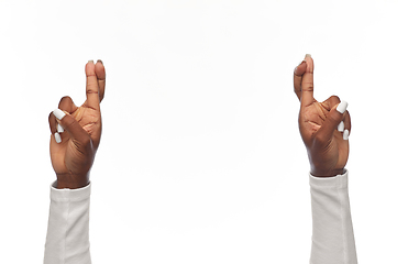 Image showing african american woman showing crossed fingers