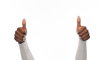 Image showing hands of african american woman showing thumbs up