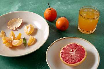 Image showing mandarins, grapefruit and glass of juice