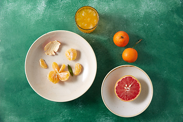 Image showing mandarins, grapefruit and glass of juice