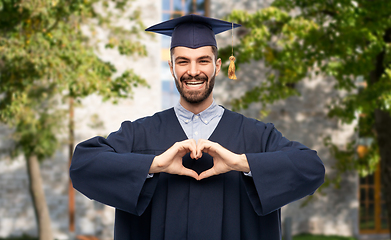 Image showing graduate student or bachelor showing hand heart