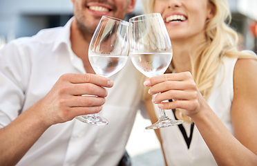 Image showing close up of couple drinking water at restaurant