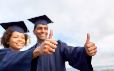 Image showing graduate students or bachelors showing thumbs up