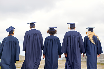 Image showing graduate students or bachelors in mortar boards