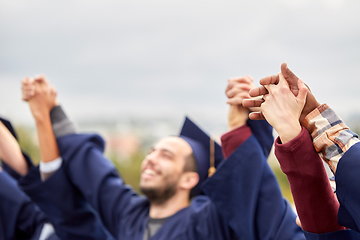 Image showing happy students celebrating graduation