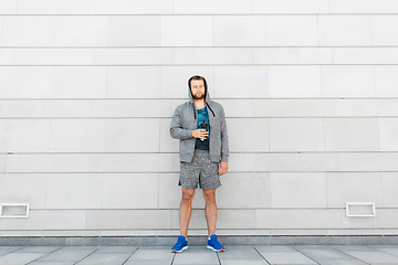 Image showing sportsman with bottle of water in city