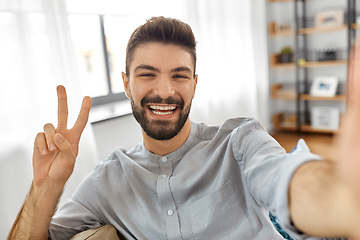 Image showing man taking selfie or having video call at home