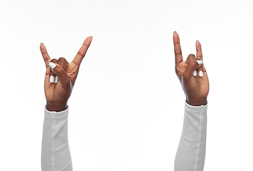 Image showing hands of african american woman showing rock sign