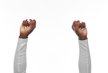 Image showing hands of african american woman showing fists