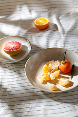 Image showing still life with mandarins and grapefruit on plate