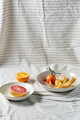 Image showing still life with mandarins and grapefruit on plate