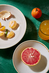 Image showing mandarins, grapefruit and glass of juice