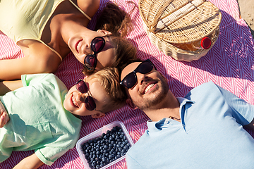 Image showing happy family having picnic on summer beach