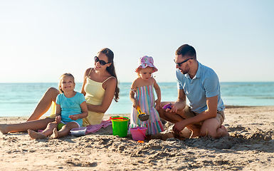 Image showing happy family with daughters on summer beach