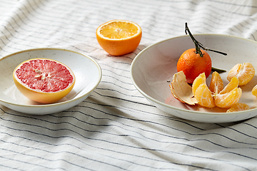 Image showing still life with mandarins and grapefruit on plate