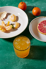 Image showing mandarins, grapefruit and glass of juice