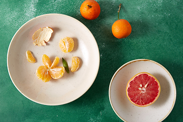 Image showing mandarins, grapefruit and glass of juice