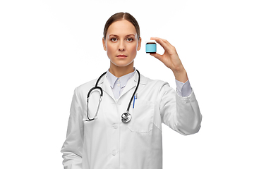 Image showing female doctor holding jar of medicine