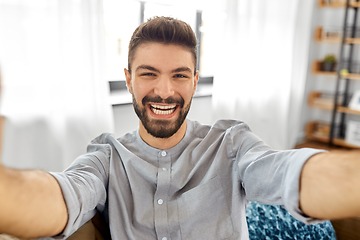 Image showing man taking selfie or having video call at home