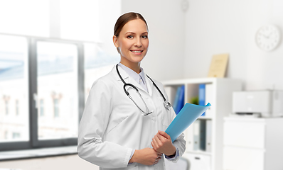 Image showing smiling female doctor with folder at hospital