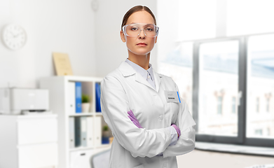 Image showing female doctor in goggles and gloves at hospital