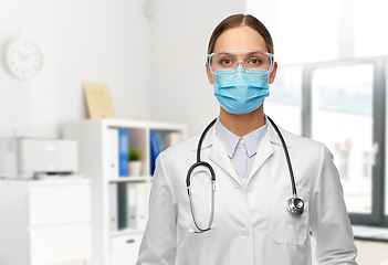 Image showing female doctor in goggles and mask at hospital