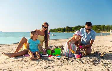 Image showing happy family with daughters on summer beach