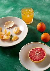 Image showing mandarins, grapefruit and glass of juice