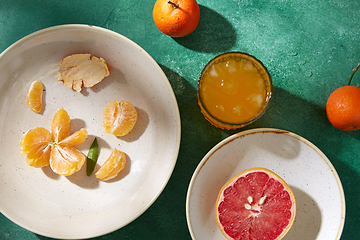 Image showing mandarins, grapefruit and glass of juice