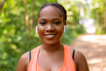 Image showing happy african american woman with earphones