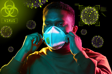 Image showing african man in respirator protecting from virus