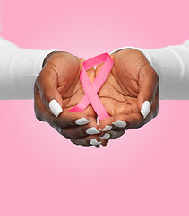 Image showing hands of woman with pink cancer awareness ribbon