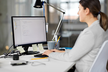 Image showing businesswoman with computer working at office