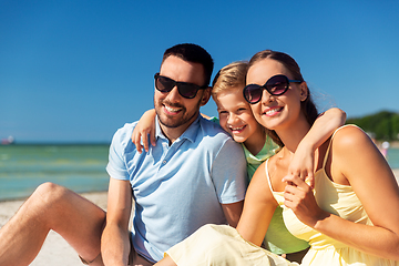 Image showing family hugging on summer beach