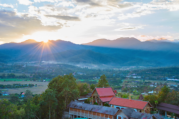 Image showing Sunset landscape with mountain village